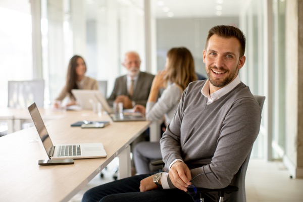 Young man sitting in office chair